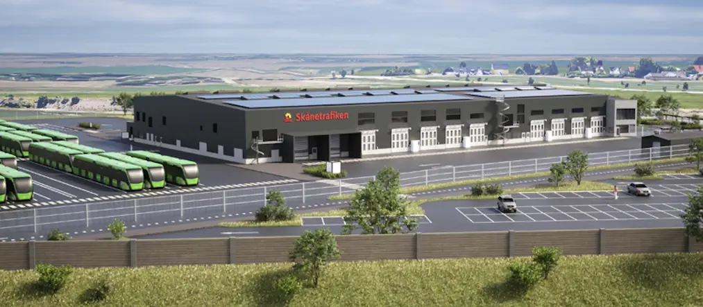 renderad bild över ett landskap med stor grå byggnad och asfalterad mark med parkerade bussar